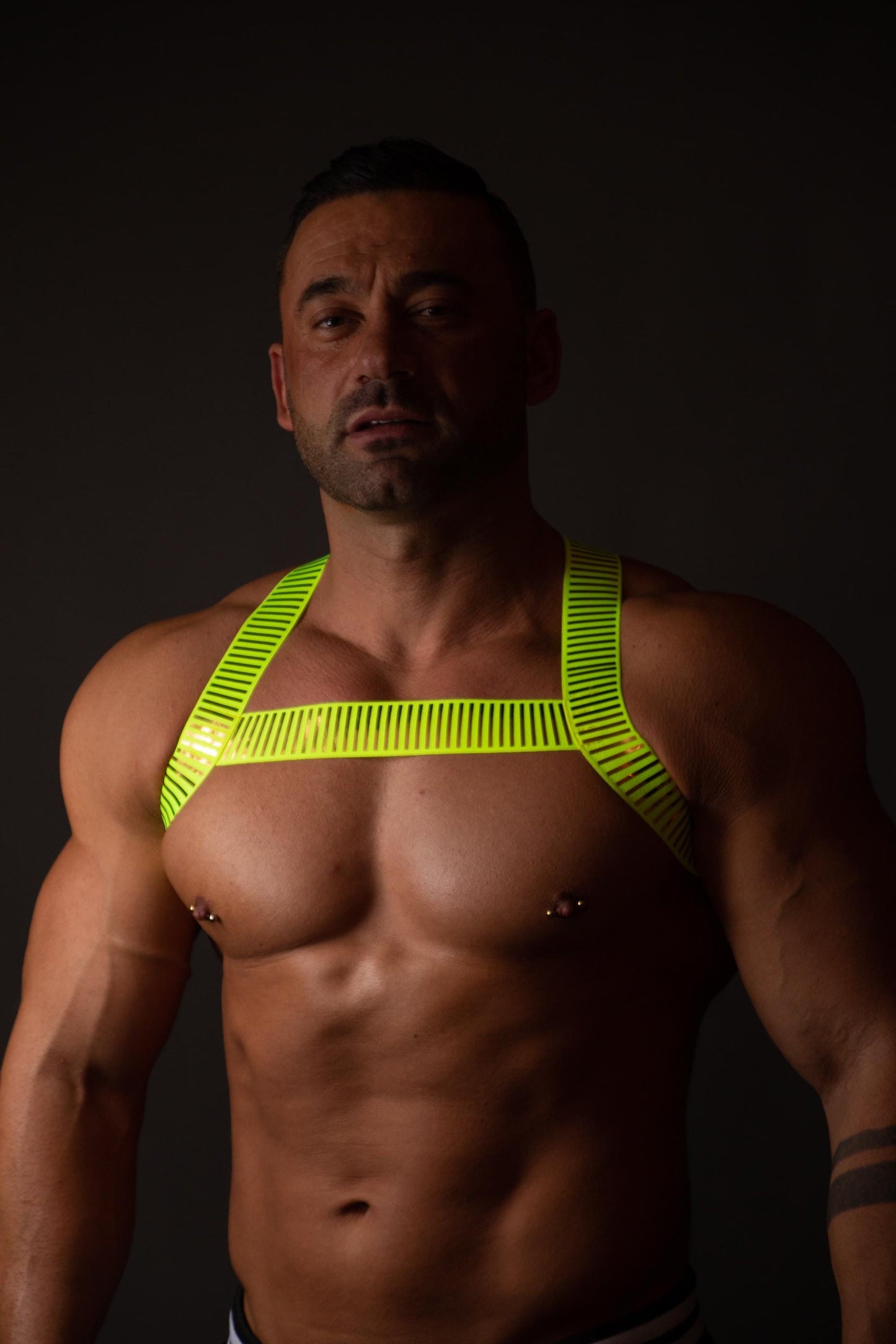 Neon green fluorescent male pride party elastic harness.